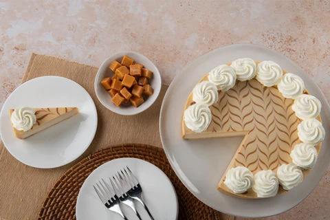 Dulce de Leche cheesecake and a plated slice, viewed from above