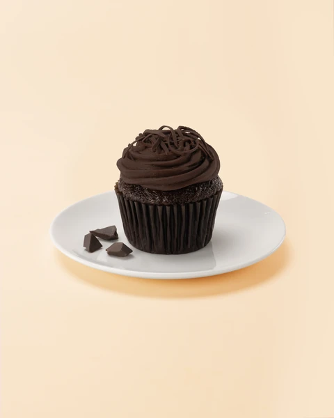The Cheesecake Factory Bakery Blackout Medium Cupcake — single cupcake on a plate