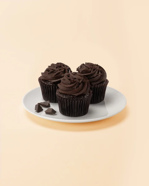 The Cheesecake Factory Bakery Blackout Mini Cupcake — three mini cupcakes on a plate