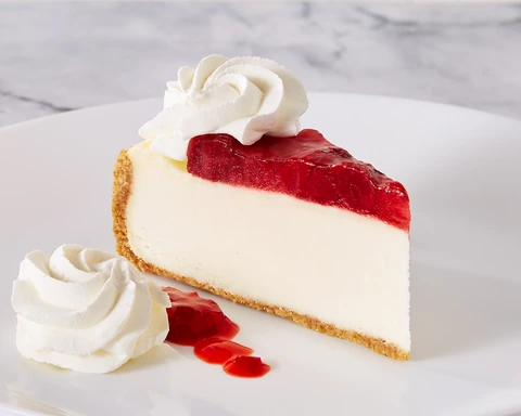 Brasserie Strawberry Topped Original Cheesecake slice with whipped cream and strawberry topping