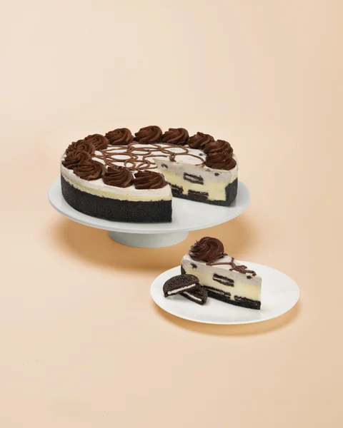 OREO® Cookies and Cream — whole cake and plated slice