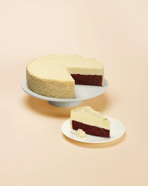 Red Velvet Cake Cheesecake — whole cake and plated slice