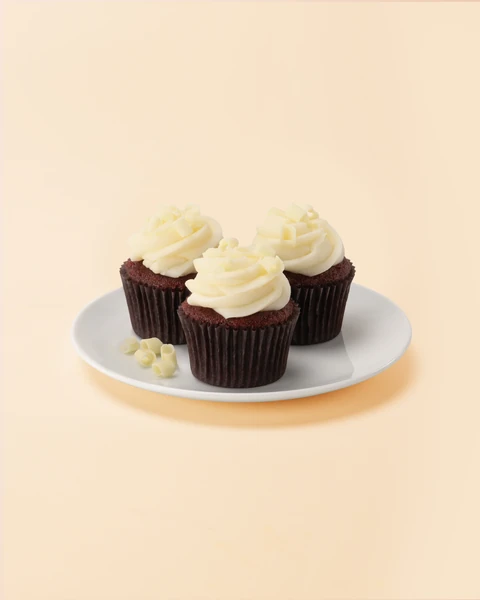The Cheesecake Factory Bakery Red Velvet Mini Cupcake — three mini cupcakes on a plate