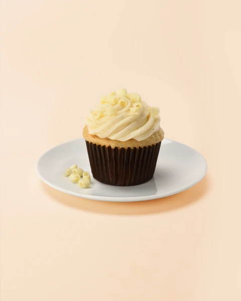 The Cheesecake Factory Bakery Vanilla Bean Medium Cupcake — single cupcake on a plate