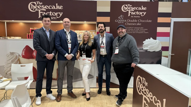 The Coveted Cakes team together at a dessert display